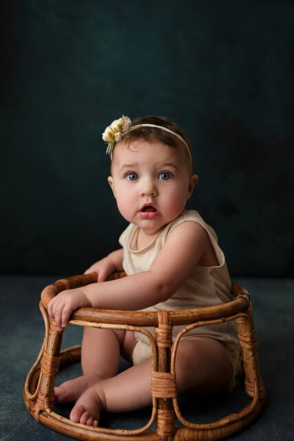 perryville newborn photographer, Cape Girardeau newborn photographer, gold outfit, baby sitting up