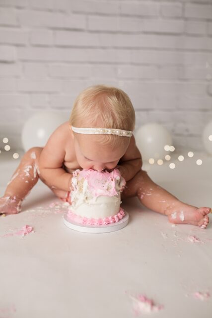 Jackson Missouri first birthday photographer, cake, first birthday photos, cake smash, baby eating cake