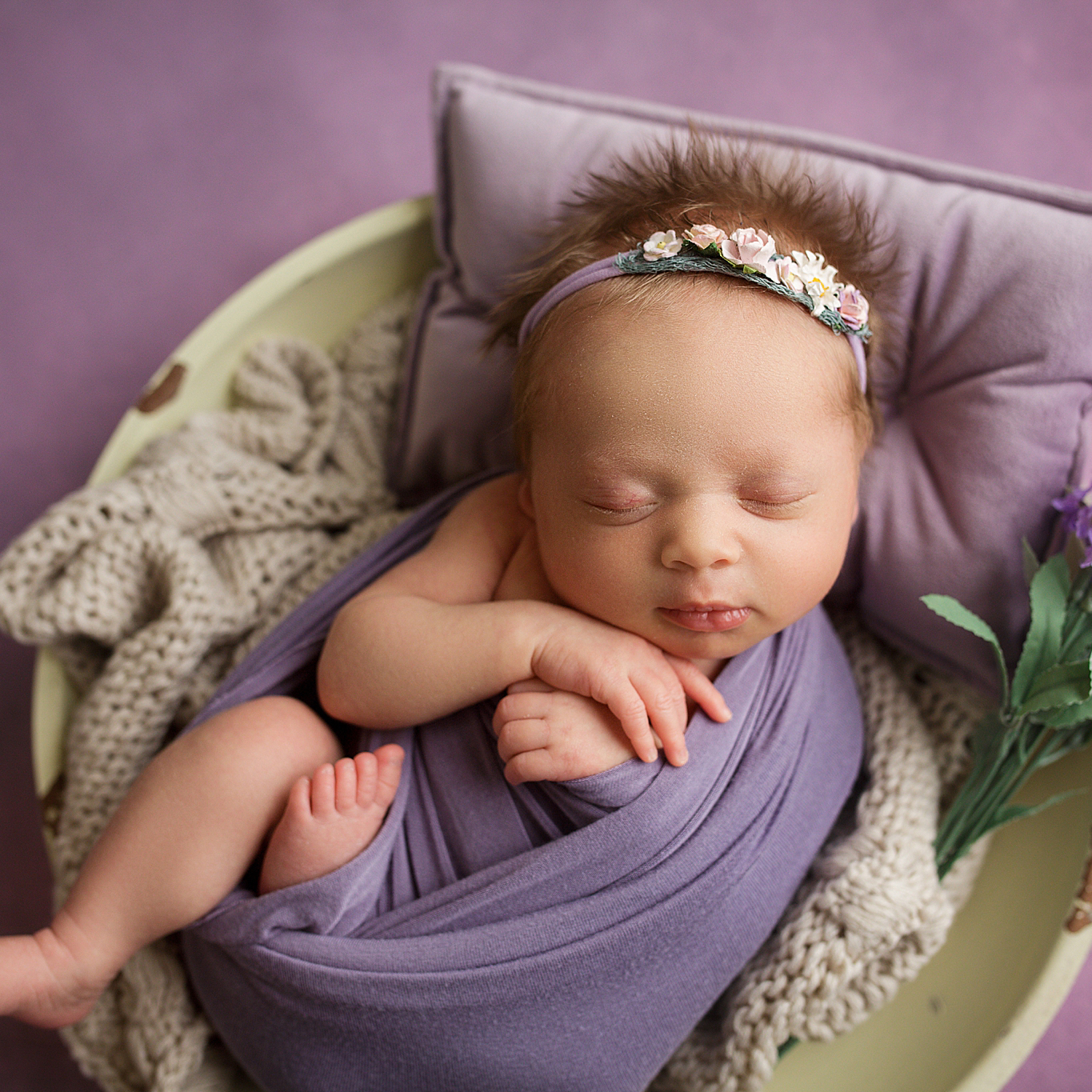 perryville newborn photographer, Cape Girardeau newborn photographer, purple pillow, purple wrap, full hair, dainty bow
