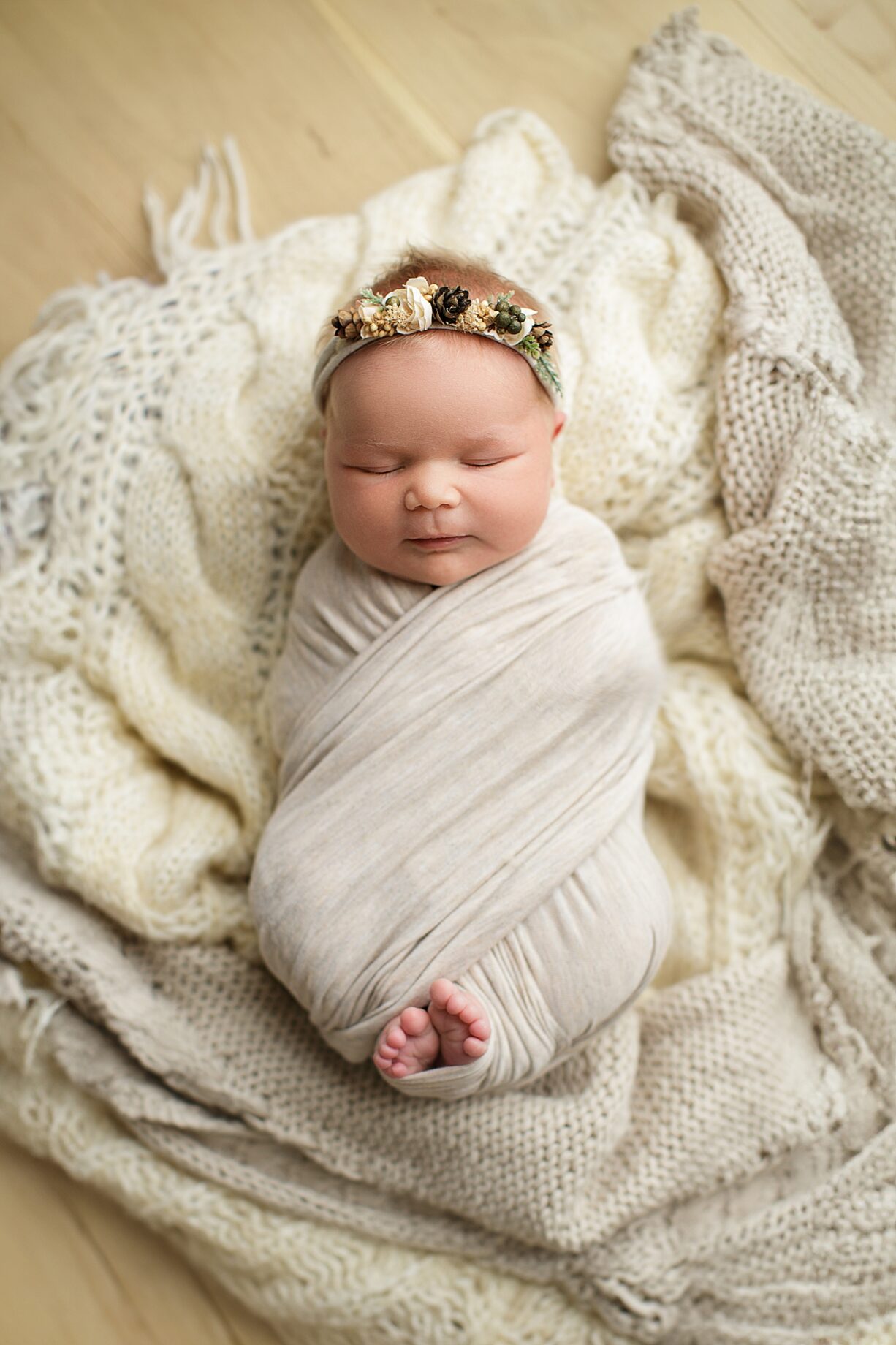 Cape Girardeau newborn photographer, Farmington newborn photographer, perryville newborn photographer, boho setup, layered backdrop, pine cone headband, baby girl