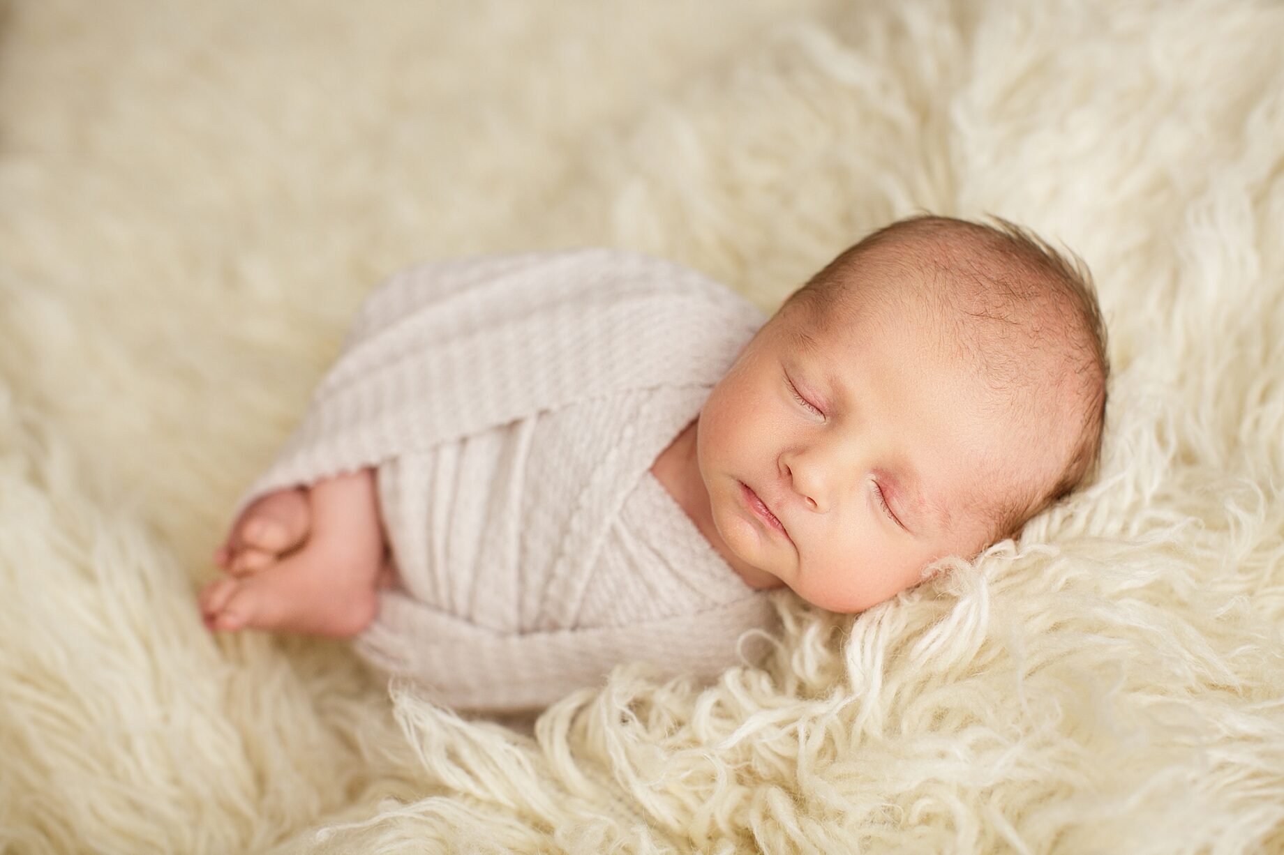St. Louis newborn photographer, perryville Missouri newborn photographer, farmington Missouri newborn photographer, fuzzy rug, white, white wrap, baby sleeping