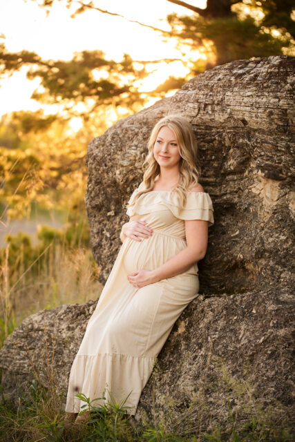 Cape Girardeau maternity photographer, perryville maternity photographer, cream pregnancy dress, big rock, sunset photos, mother, holding belly