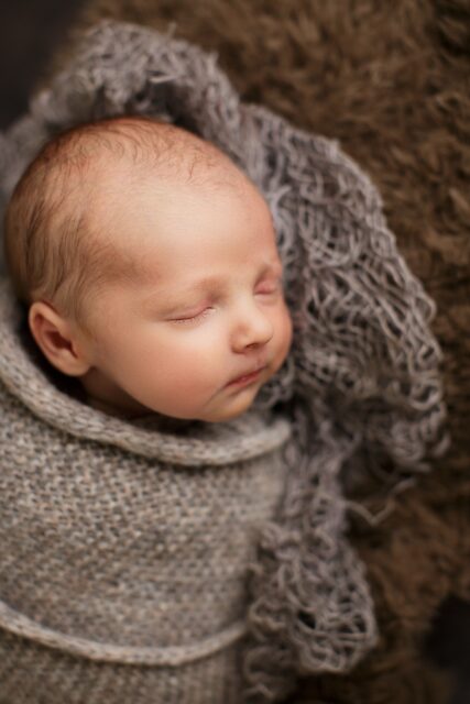 farmington Missouri Newborn photographer, st Louis Missouri Newborn photographer, side profile, baby boy, newborn photography, sleeping baby, grey wrap, studio photography