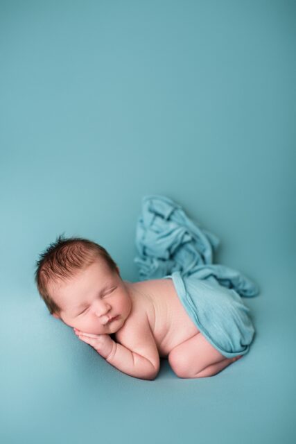 Cape Girardeau newborn photographer, St. Louis newborn photographer, perryville Missouri Newborn photographer, farmington newborn photographer, teal blanket, baby laying on side, hair