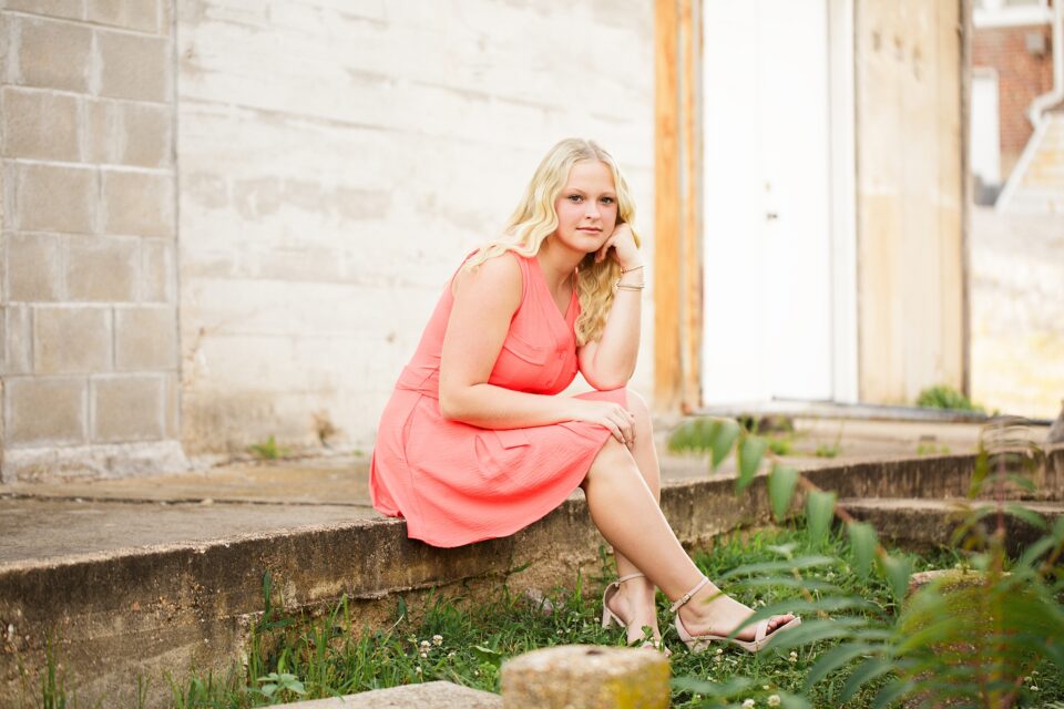 perryville missouri high school senior photographer, cape girardeau high school senior photographer, farmington missouri newborn photographer, missouri high school senior photographer, Jackson missouri photographer, girl, downtown, girl sitting, orange dress, blonde hair