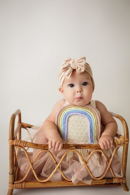 Jackson Missouri newborn photographer, Perryville cake smash photographer, Cape Girardeau newborn photographer, rainbow baby, rainbow baby outfit, studio, white backdrop, baby girls first birthday