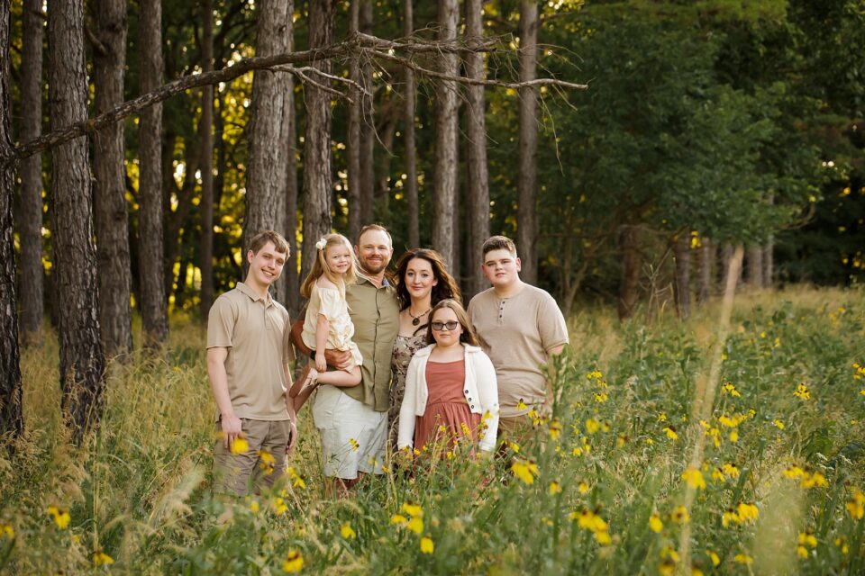 Cape Girardeau newborn photographer, perryville photographer, Farmington newborn photographer, family photos, summer photoshoot, pine trees, wild flowers, big family