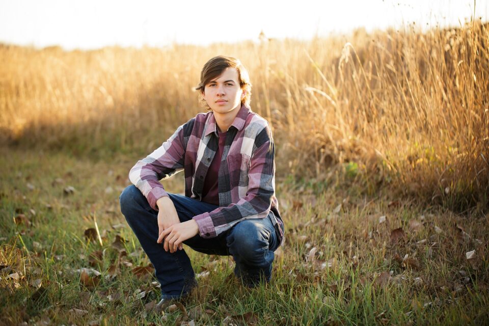 perryville senior photographer, Cape Girardeau senior photographer, high school senior, boy, tall grass, plaid shirt