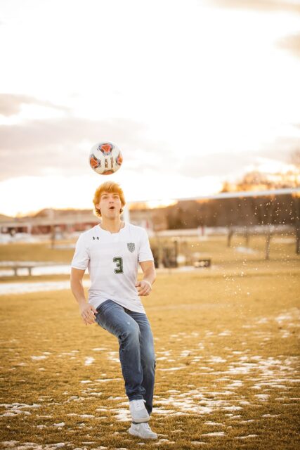 Cape Girardeau senior photographer, perryville senior photographer, Farmington photographer, soccer, soccer ball, snow, golden light