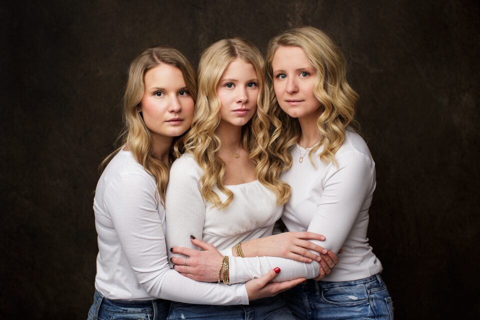 Farmington Missouri family photographer, Perryville photographer, sisters, studio photoshoot, brown backdrop, intuition backgrounds, white shirts
