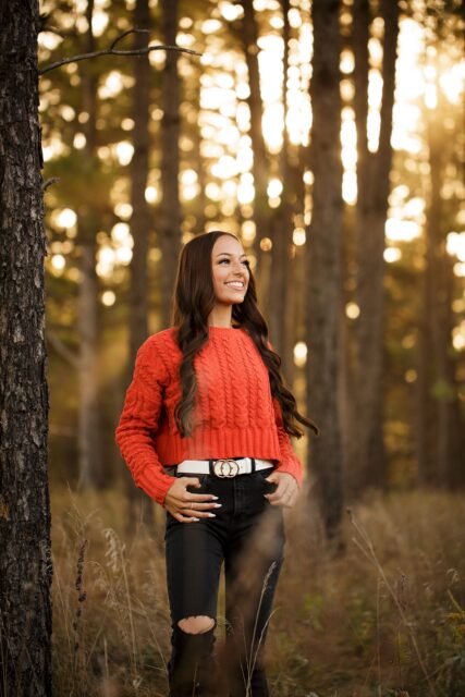 perryville senior photographer, Cape Girardeau senior photographer, Farmington senior photographer, pine trees, looking up, black ripped jeans, sunset, forest