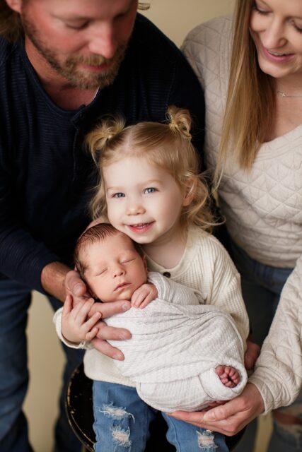 st Louis newborn photographer, perryville Missouri Newborn photographer, sister holding baby, baby boy, family photo session, farmington Missouri Newborn photographer